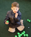 Joseph digging through the Easter treasures!
